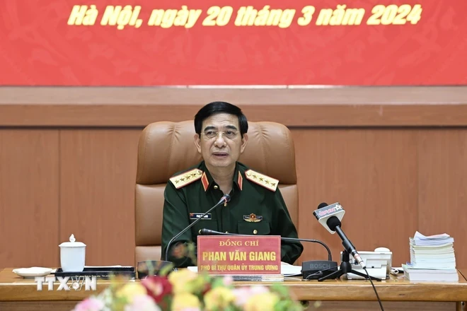 Đại tướng Phan Văn Giang, Ủy viên Bộ Chính trị, Phó Bí thư Quân ủy Trung ương, Bộ trưởng Bộ Quốc phòng chủ trì hội nghị. (Ảnh: TTXVN phát)