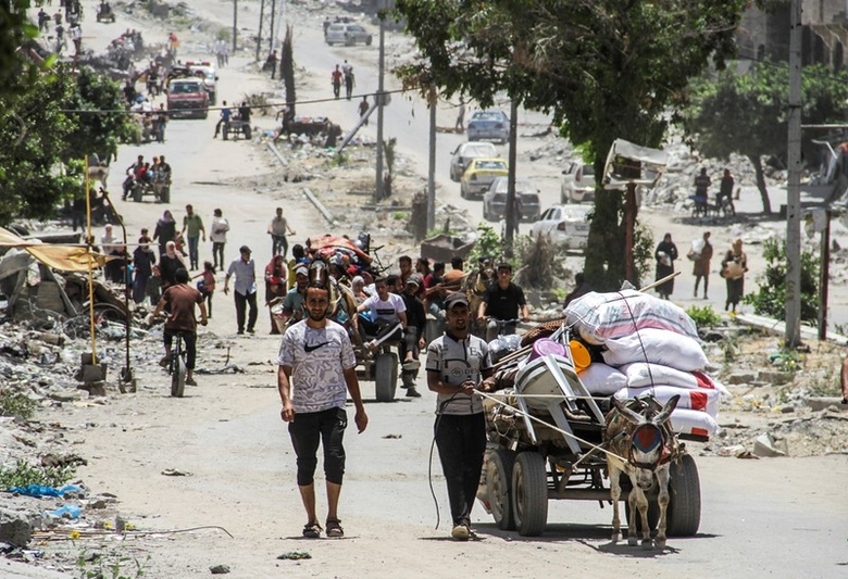 Người dân Palestine sơ tán từ Jabalia, miền Bắc Dải Gaza tới thành phố Gaza ngày 24/5/2024.