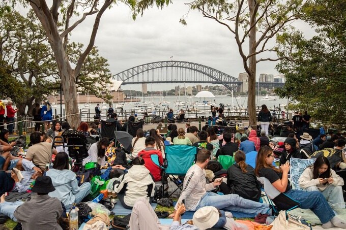Crowds gather at Mrs Macquaries Point ahead of the New Years Eve fireworks display in Sydney on December 31, 2023. (AFP).jpg