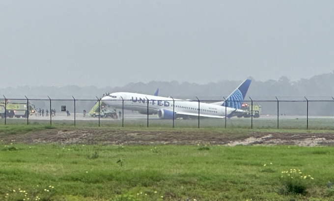 United Airlines plane skids off Houston airport runway