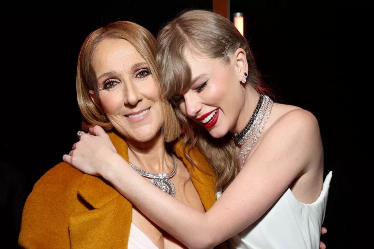 Taylor Swift ôm chầm lấy Celine Dion sau khi nữ diva trao cho cô giải Grammy 2024 cho Album của năm - Ảnh: GETTY IMAGES